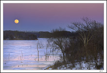 Frozen Lake Shimmers In The Warmth Of Moonglow