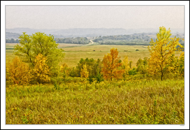 An Autumn Road Winds Into the Foggy Bluffs