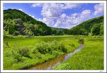 Distant Gravel Road On The Creek Line
