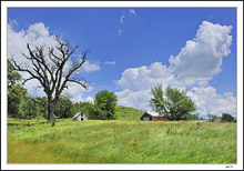 Cloud Towers Above Rural Landmarks