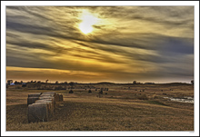 Turbulent Sunset Over Early Winter Fields