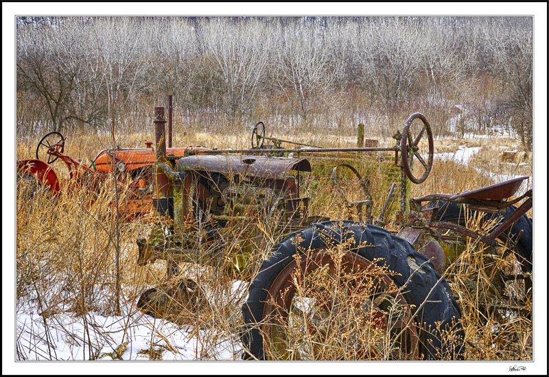 Tractors In Exile Against A Silver Valance