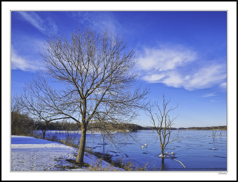 Cloud Wisps Across Frozen Waters