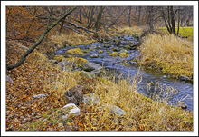 Autumn Lingers On The Winter Hillsides Above The Lake & Creek